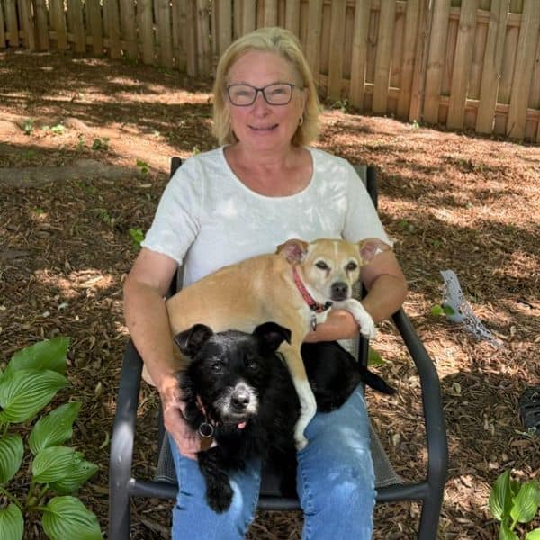 Dog and woman enjoying outdoor time at Lakeside Pet Sitting.