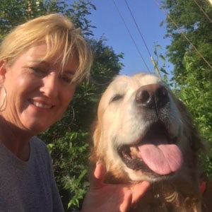 Happy dog with owner at Lakeside Pet Sitting, enjoying outdoor time and personalized pet care servic.