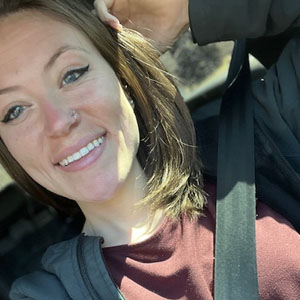 Friendly pet sitter smiling, ready to care for your pets in Lakeside.