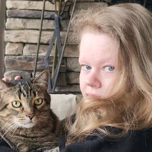 Girl with her cat at Lakeside Pet Sitting, offering loving pet care services.